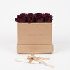 Cajas de rosas La Midi Gold Rose Morado de BELLE FLEUR ECUADOR, con rosas moradas en elegante caja decorativa.